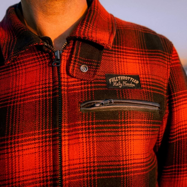 Close-up of flannel texture and technical details on the Holyfreedom custom riding jacket.