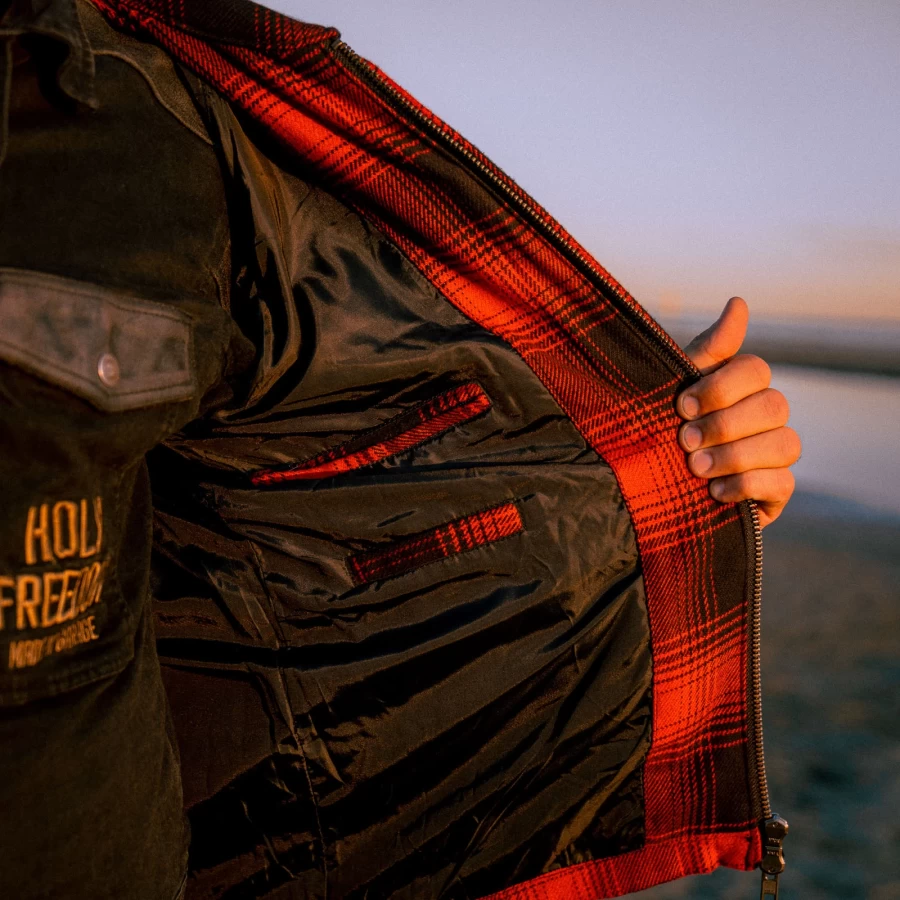 Close-up of flannel texture and technical details on the Holyfreedom custom riding jacket.