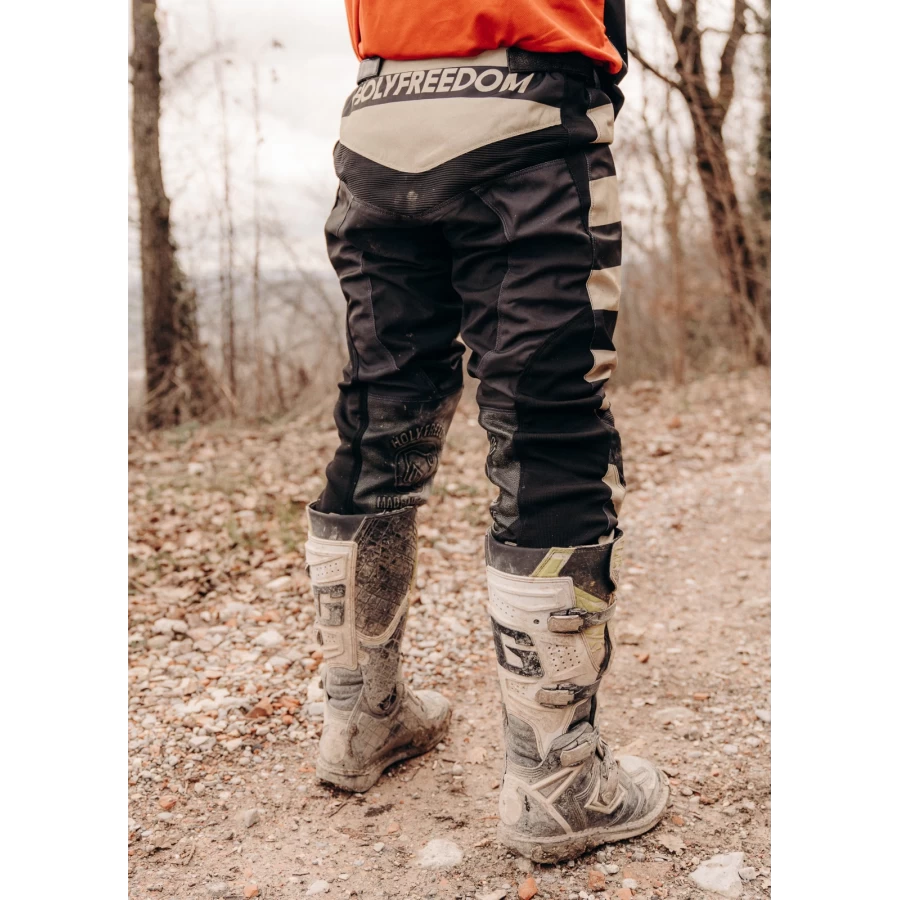 Mud Black trousers styled for off-road riding with custom jacket and boots.