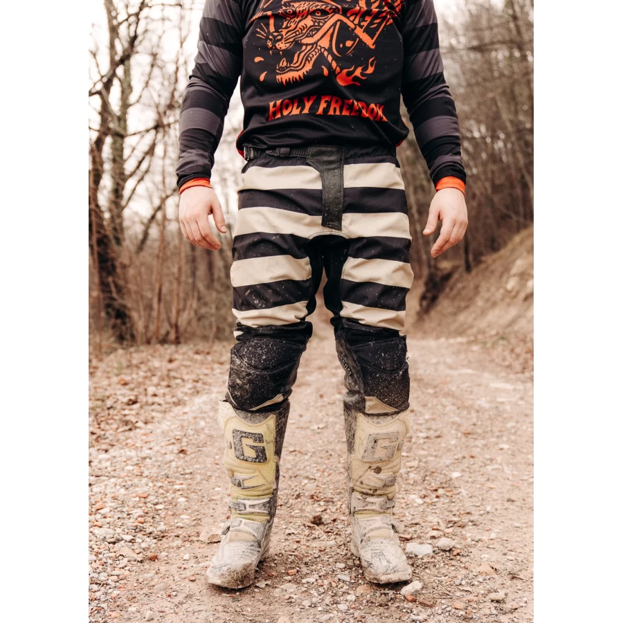 Mud Black trousers styled for off-road riding with custom jacket and boots.