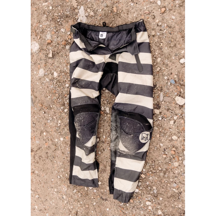 Front view of Mud Black technical off-road trousers with a clean riding fit.