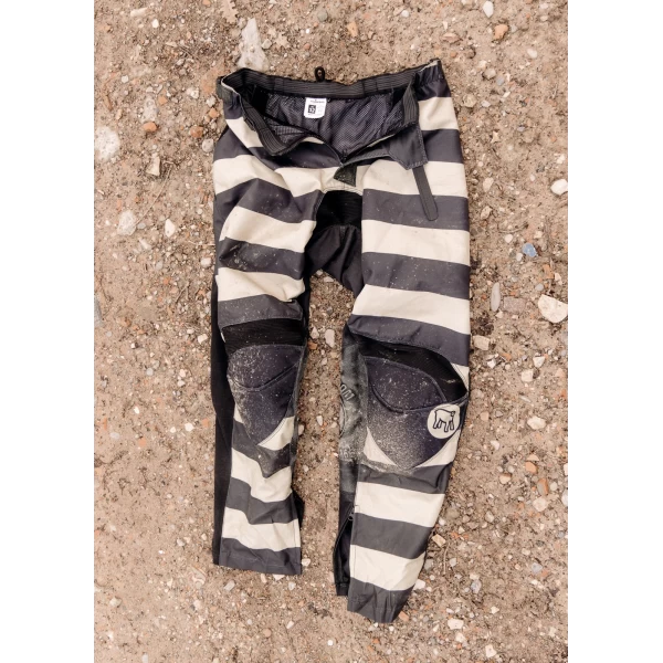 Front view of Mud Black technical off-road trousers with a clean riding fit.