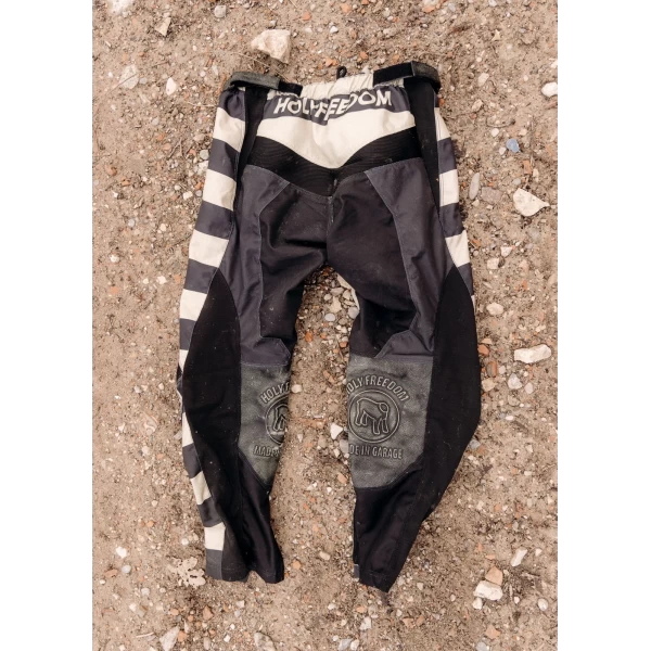 Front view of Mud Black technical off-road trousers with a clean riding fit.