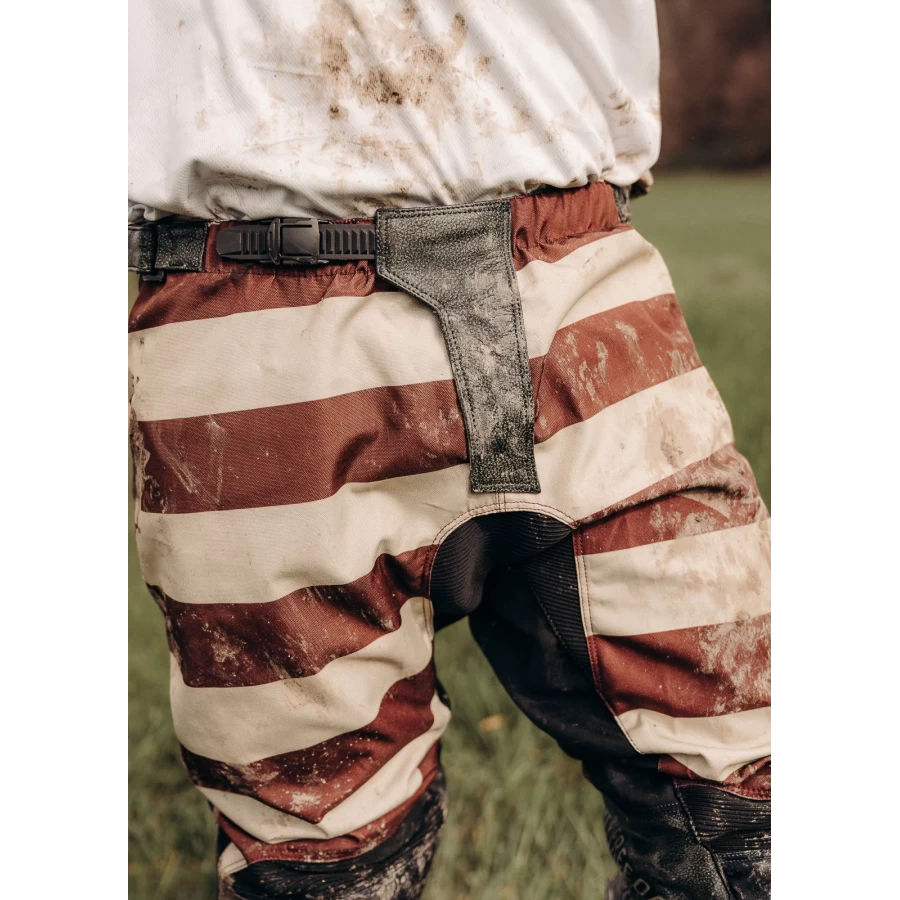 Close-up of Mud Bordeaux fabric and technical finish with scrambler character.