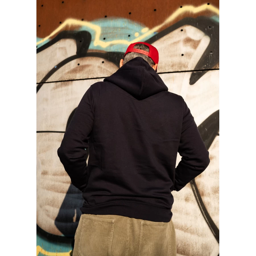 Holyfreedom navy hoodie worn in the city for a simple and authentic rider outfit.
