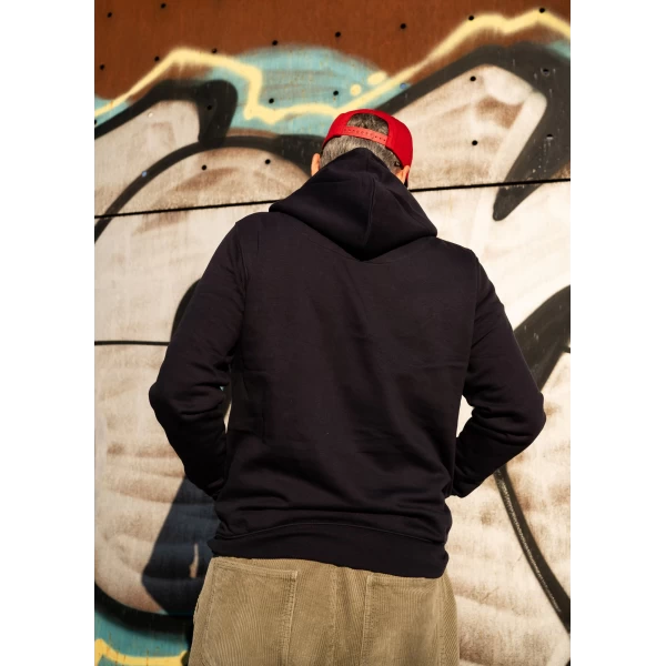 Holyfreedom navy hoodie worn in the city for a simple and authentic rider outfit.