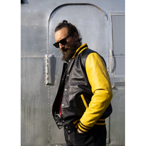 Yellow varsity jacket fitted on a rider for streetwear and motorcycle use