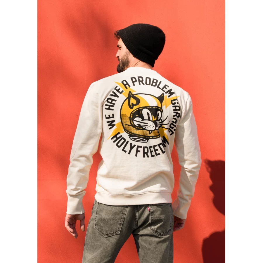 Close-up of the AstroCatz original graphic on a custom sweatshirt with artist detail.