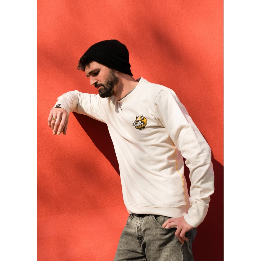Close-up of the AstroCatz original graphic on a custom sweatshirt with artist detail.