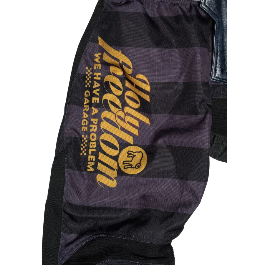 Close-up of the technical fabric and Holyfreedom finishing on Mud Petrol riding trousers.