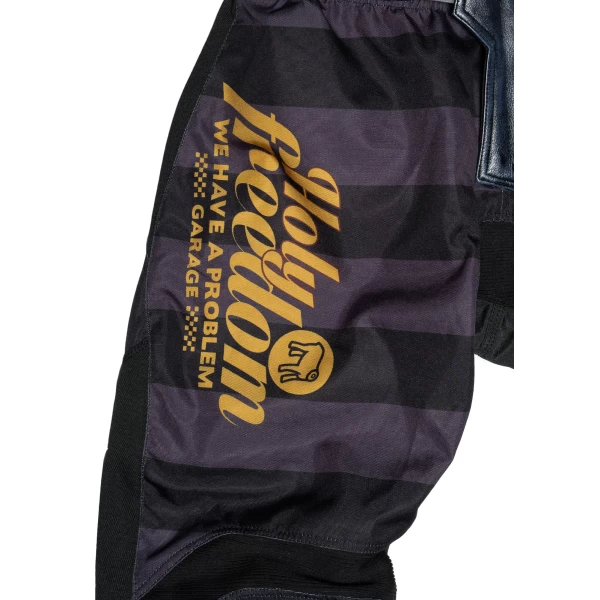 Close-up of the technical fabric and Holyfreedom finishing on Mud Petrol riding trousers.