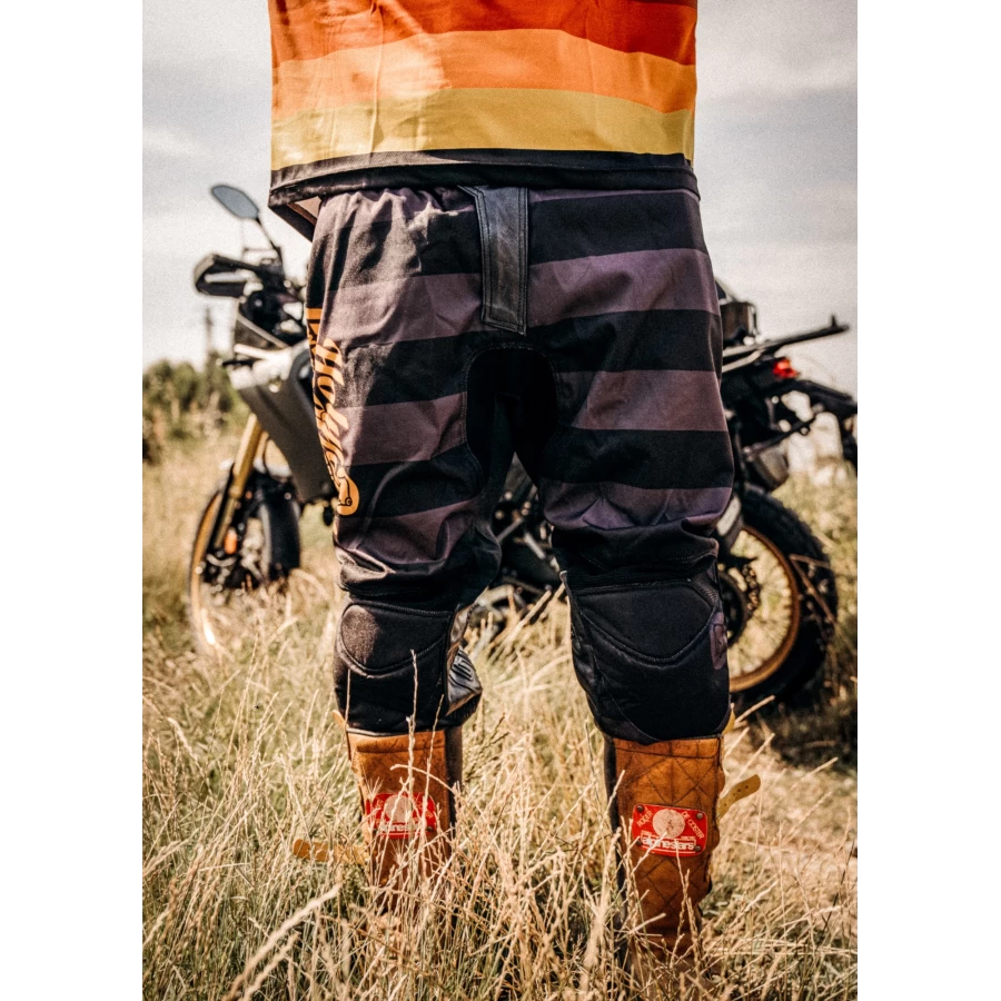 Mud Petrol scrambler trousers worn for off-road and urban riding with a clean custom look.