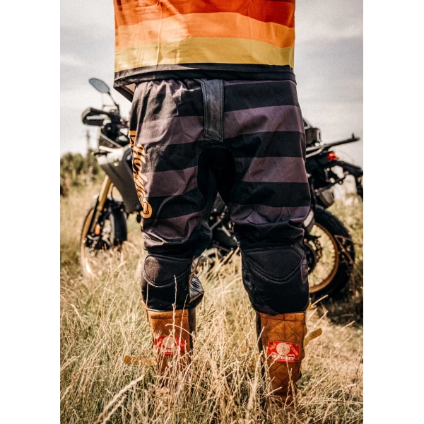 Mud Petrol scrambler trousers worn for off-road and urban riding with a clean custom look.