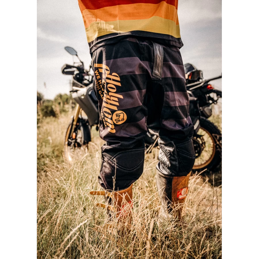 Mud Petrol scrambler trousers worn for off-road and urban riding with a clean custom look.