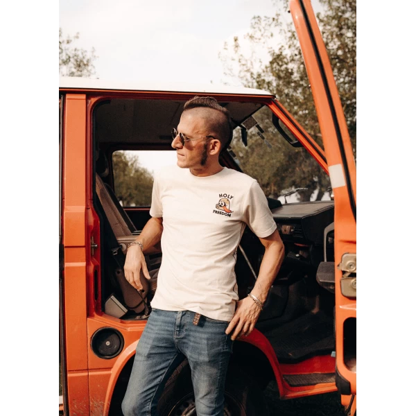 Revenge Tee styled in a custom outfit with denim and a motorcycle jacket.