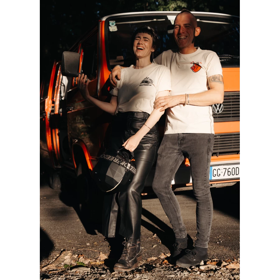 Fit and lifestyle shot of a vintage motorcycle T-shirt styled with denim and boots.