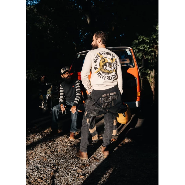 Biker lifestyle shot of the Holyfreedom crewneck sweatshirt, casual and retro.