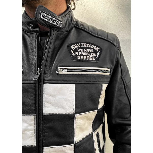 Close detail of the leather finish and Holyfreedom trims on the CE jacket.
