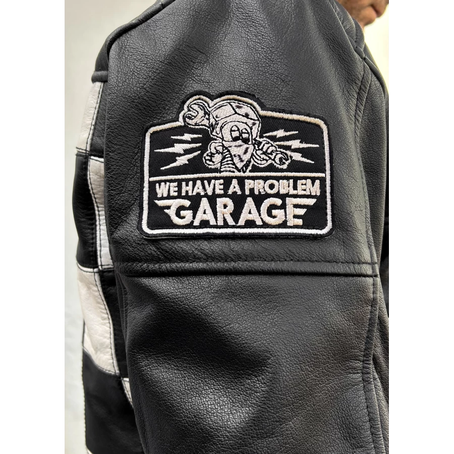 Close detail of the leather finish and Holyfreedom trims on the CE jacket.