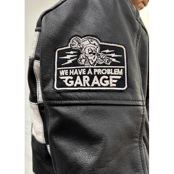 Close detail of the leather finish and Holyfreedom trims on the CE jacket.