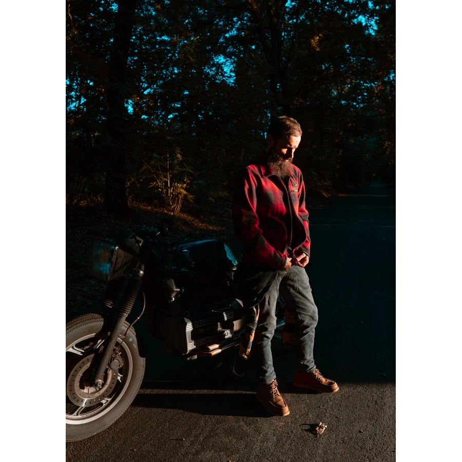 Fit and lifestyle image of the Holyfreedom flannel jacket worn for urban riding and daily wear.