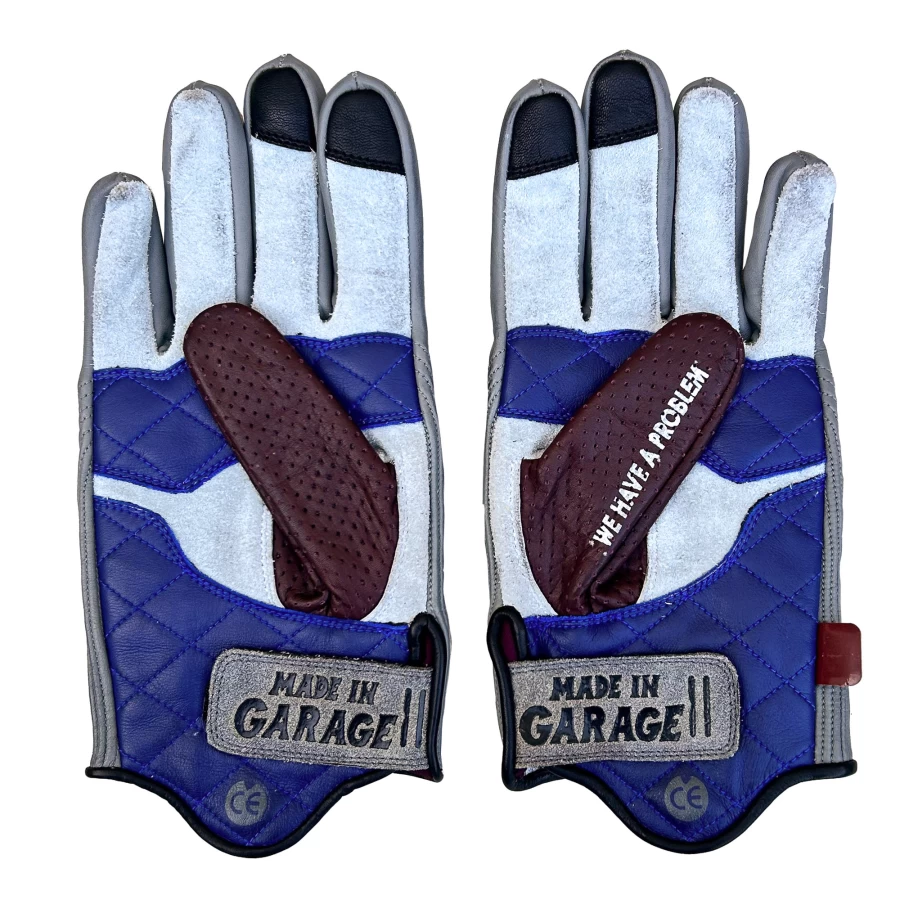 Detail shot of Bullit Tomba gloves showing refined stitching and Holyfreedom character.