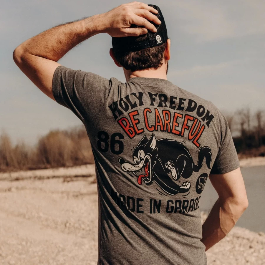 Graphic detail of the Be Careful tee, highlighting the subtle message and melange texture.