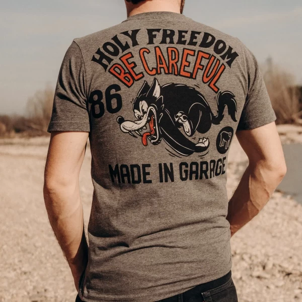 Graphic detail of the Be Careful tee, highlighting the subtle message and melange texture.