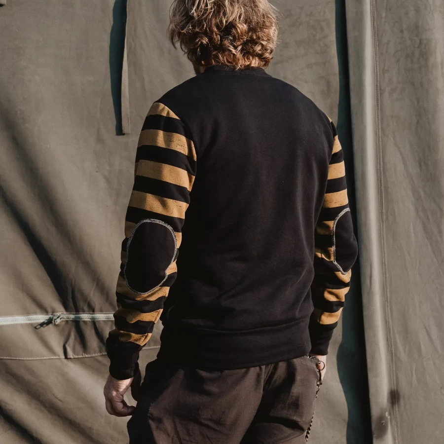 Biker lifestyle image of the crewneck, combining retro style with everyday comfort.