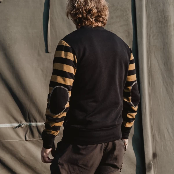 Biker lifestyle image of the crewneck, combining retro style with everyday comfort.