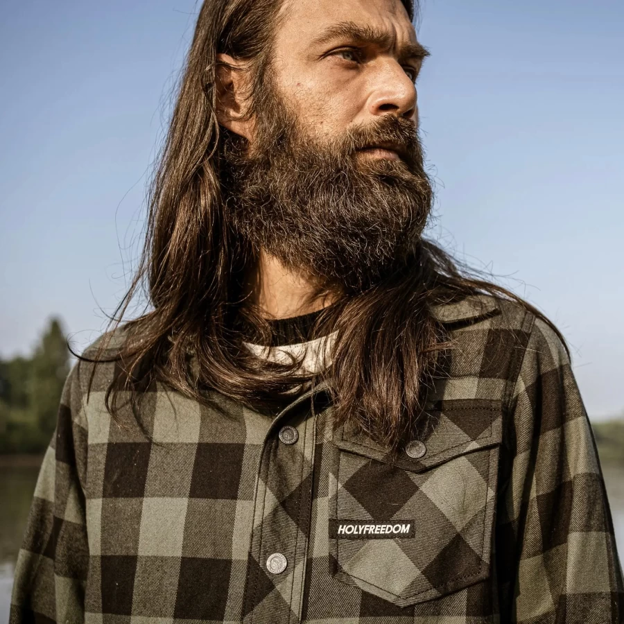 Detail of the Jessie James green plaid fabric and buttons on the Holyfreedom shirt.