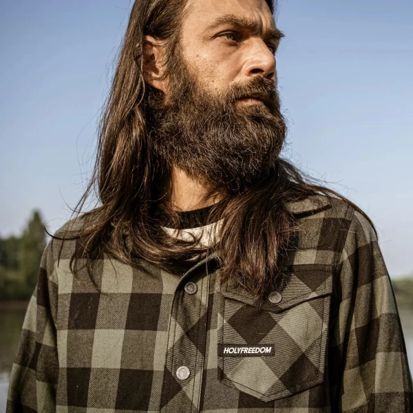 Detail of the Jessie James green plaid fabric and buttons on the Holyfreedom shirt.