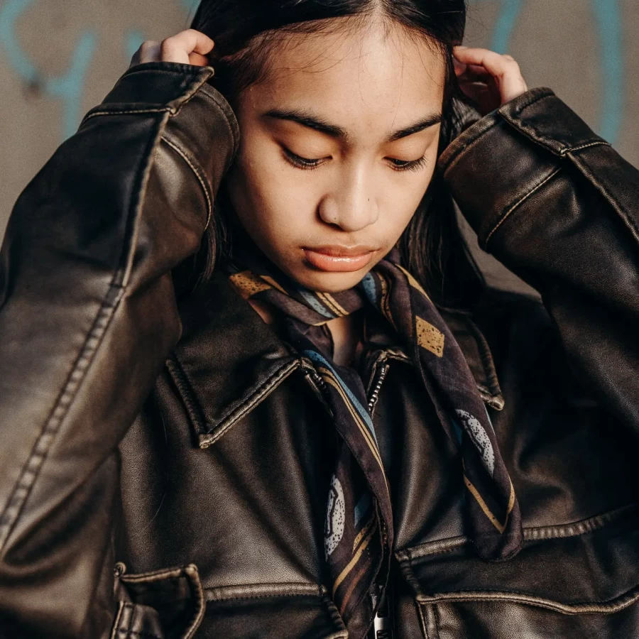 Holyfreedom scarf worn with a cafe racer jacket, adding a bold vintage touch to rider outfits.