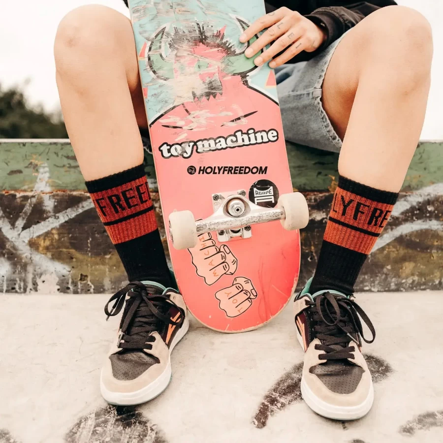 Graphic detail on Holyfreedom motorcycle socks with artistic lines and custom identity.