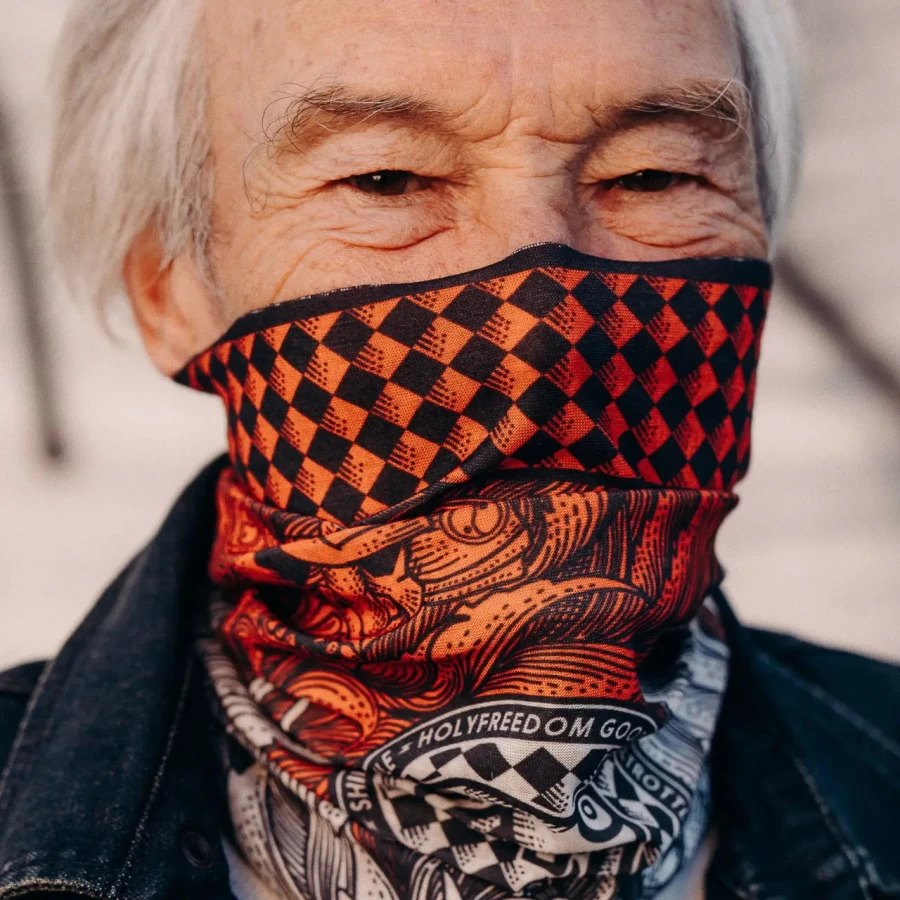 Lifestyle shot of a tube scarf worn on a custom bike ride with cafe racer attitude.