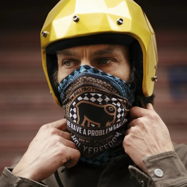 Lifestyle fit on a custom bike rider, showing the tube scarf as a practical neck layer.