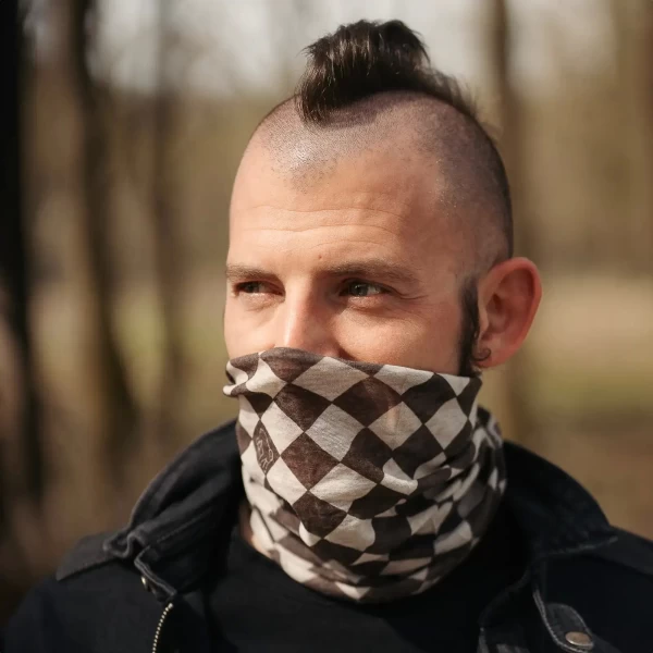 Motorcycle tube scarf worn under a helmet for cafe racer rides and city commuting.