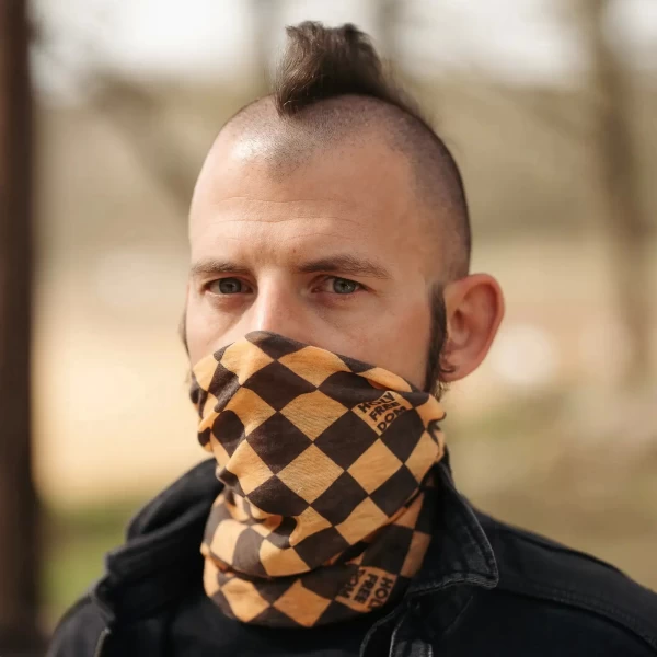 Yellow merino tube scarf worn under a helmet for a standout cafe racer winter look.