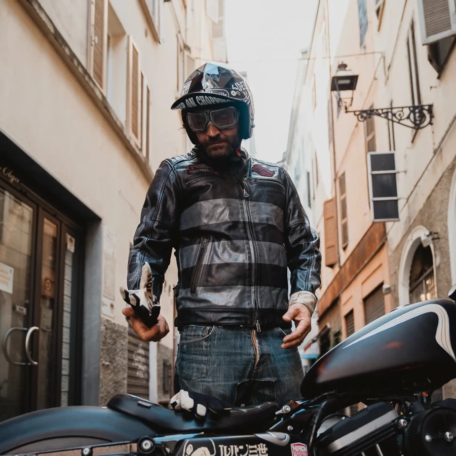 On-bike fit for an authentic vintage cafe racer leather jacket with dark attitude.
