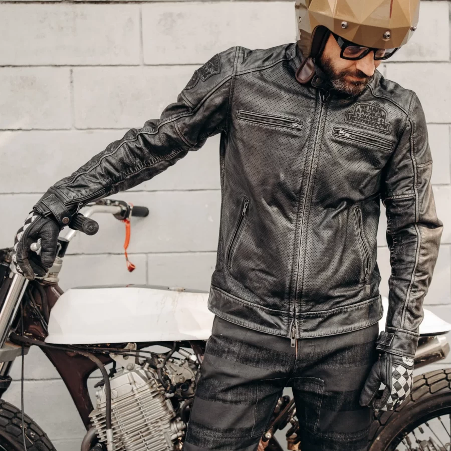 Fit on a custom bike rider wearing a summer leather motorcycle jacket with vintage attitude.