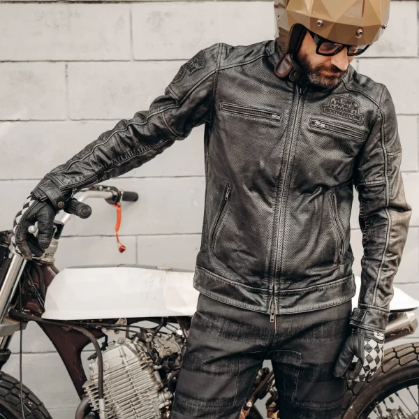 Fit on a custom bike rider wearing a summer leather motorcycle jacket with vintage attitude.