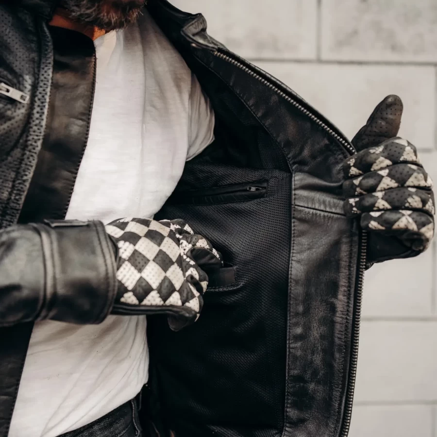 Detail of the black leather finish and clean stitching on this Holyfreedom riding jacket.
